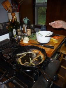Scapes, peppers and carrots frying
